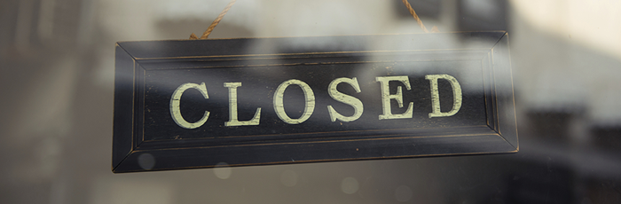 Close up of closed shop sign