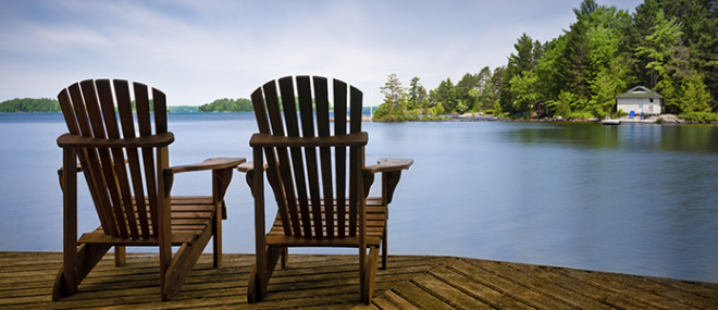 Chairs on a lakeside dock.