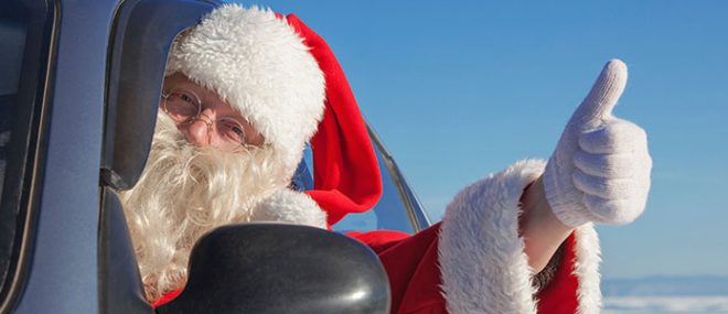 Santa Claus driving a car.