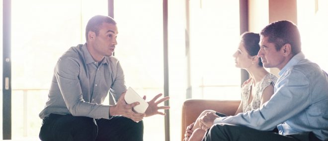 Couple meeting with their small business insurance broker.