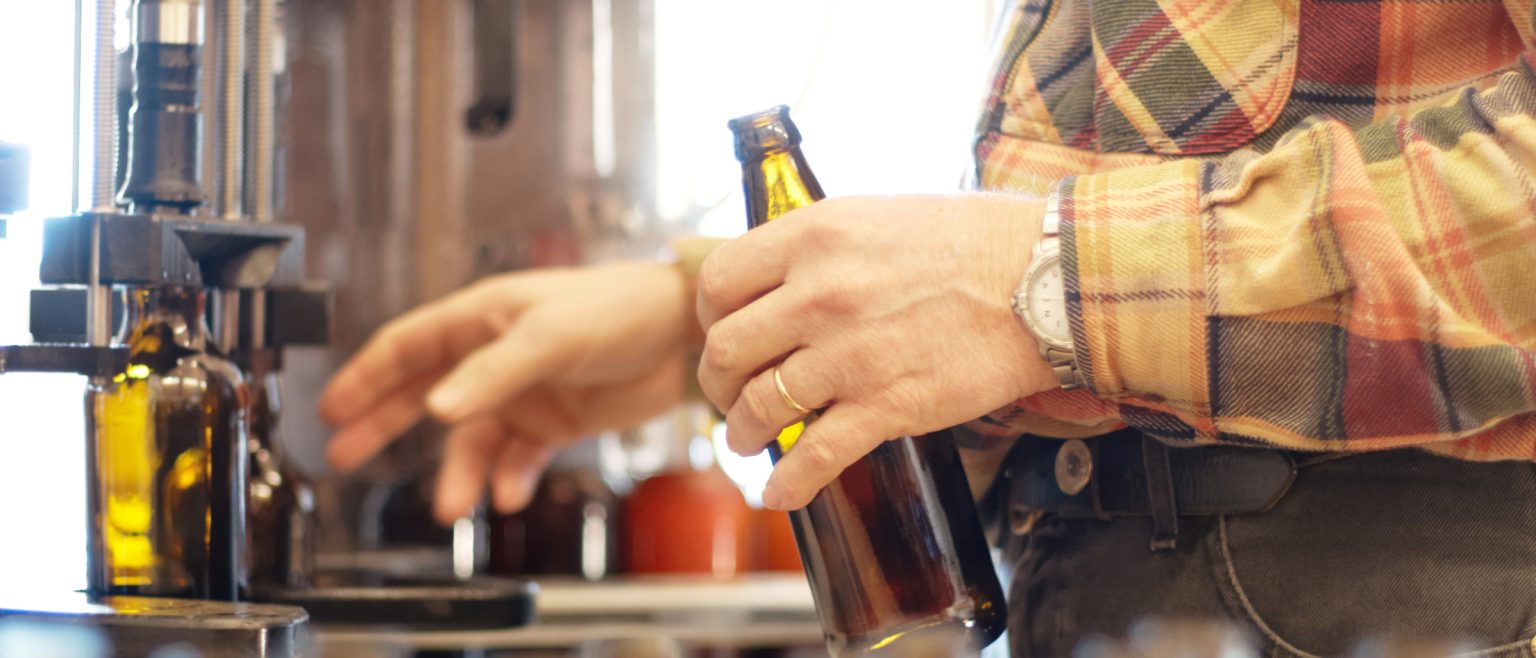 beer bottles on an assembly line.