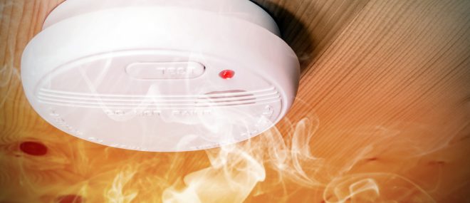 smoke detector with smoke drifting across.