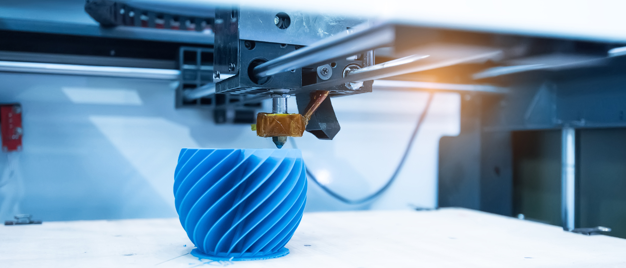 3D printing machine making a plastic device.