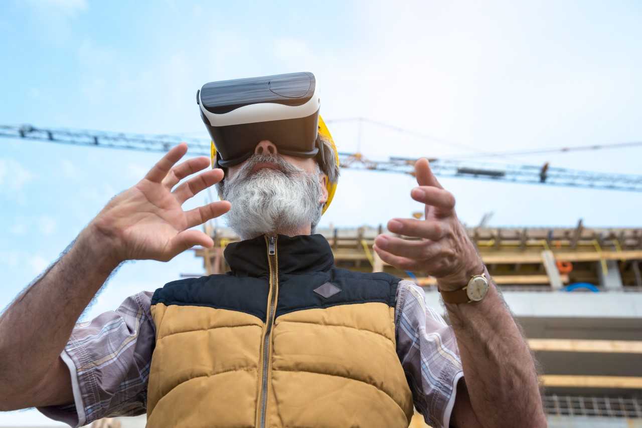 man with VR headset on construction site.