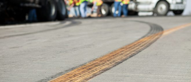 skid marks on the road following truck collision