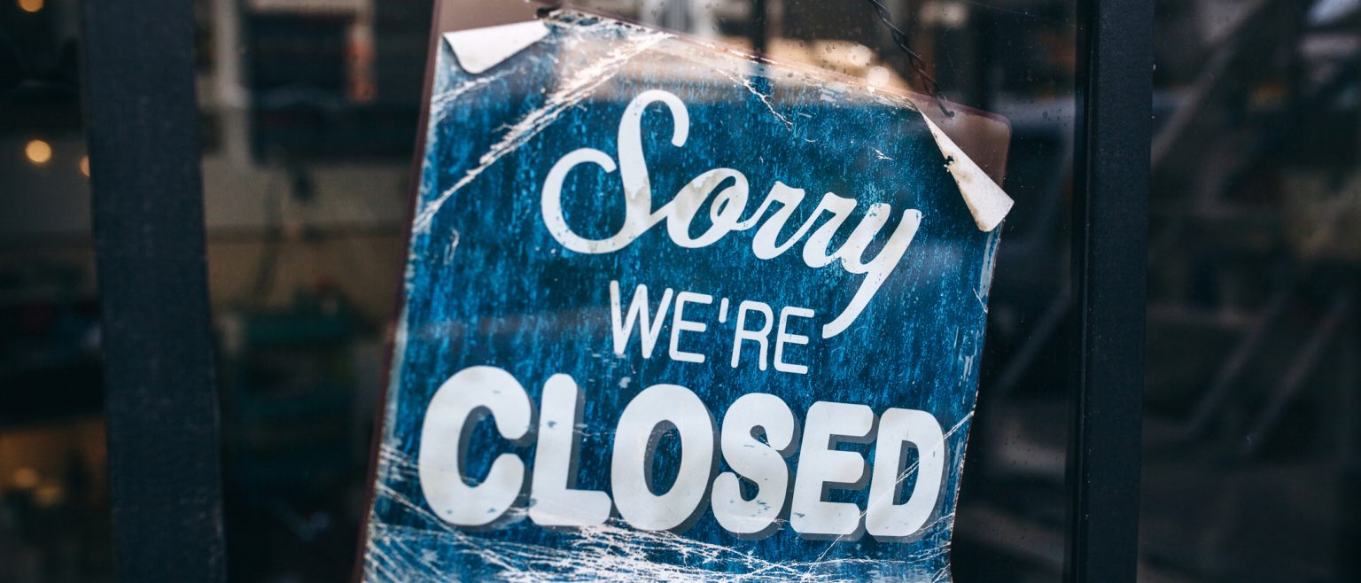 A business closing time sign.