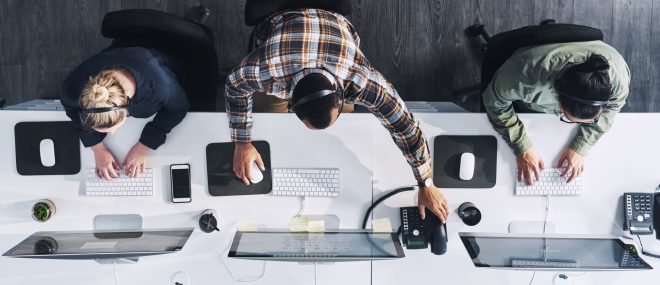 A group of people on their computers.