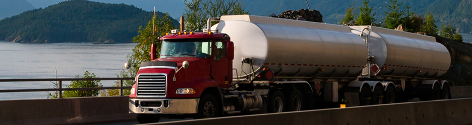 A tanker truck driving on a road.