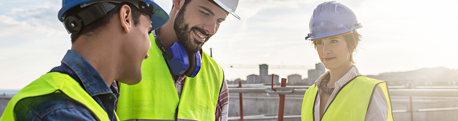 Construction architect contractor GM looking over blue print