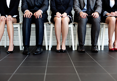 Bottom view of people sitting waiting for job interview.