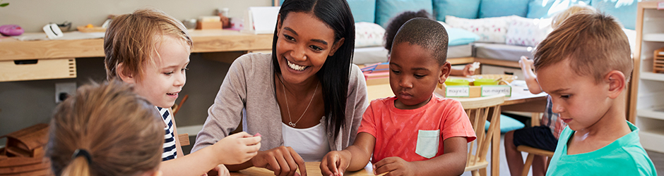 educator smiling at children