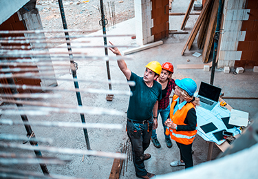 A risk service team member assessing risk on a construction site.