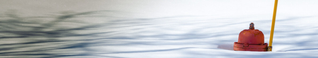 Fire hydrant poking out of deep snow