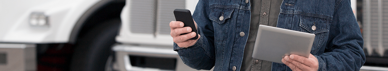 a driver holding a phone