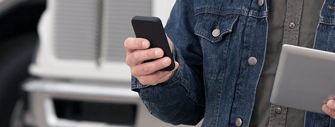 a driver holding a phone