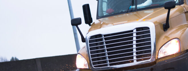 Semi truck driving on wet highway