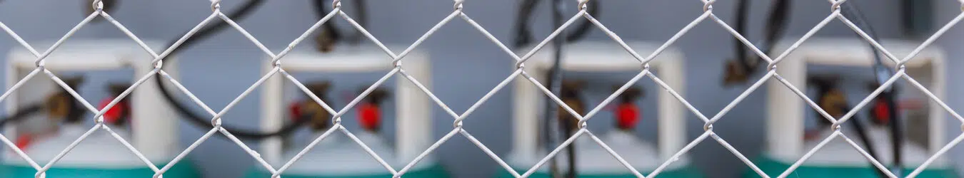 Gas storage space with steel cross fence protection for safety.