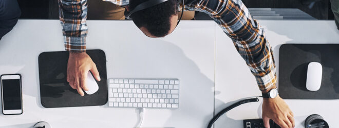 A group of people on their computers.