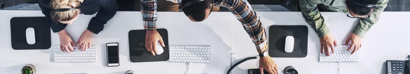 A group of people on their computers.