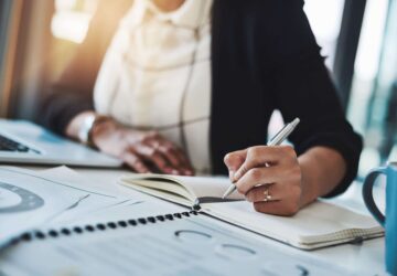 Woman jotting down notes